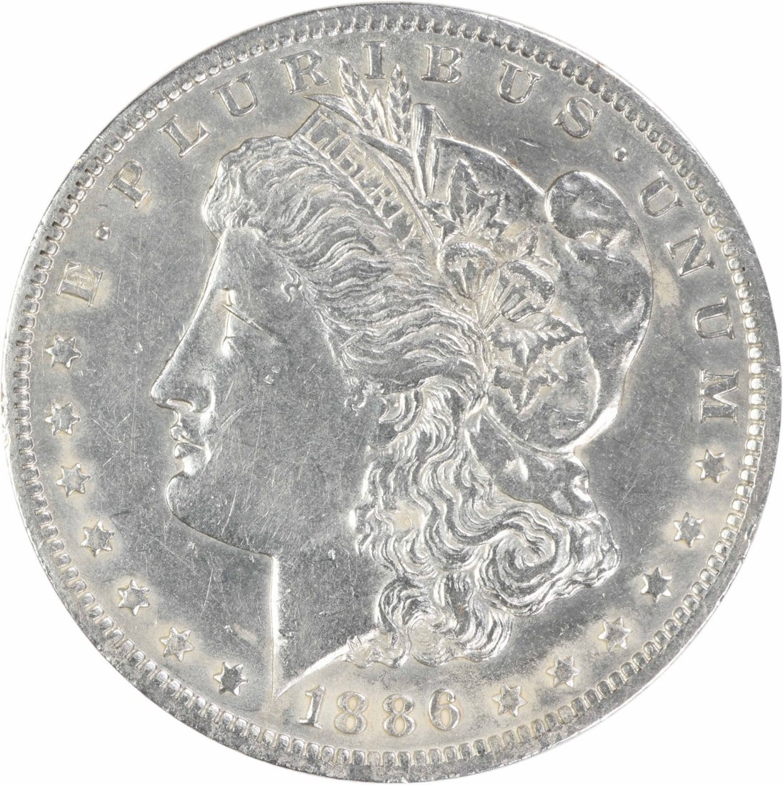 1886 O New Orleans Morgan Dollar EF Uncertified Silver Coin: 1886 O New Orleans Morgan Dollar EF Uncertified Silver Coin An 1886-O Morgan Silver Dollar graded EF and offered uncertified. This circulated coin is made of 90% silver and 10% copper, with a reeded e