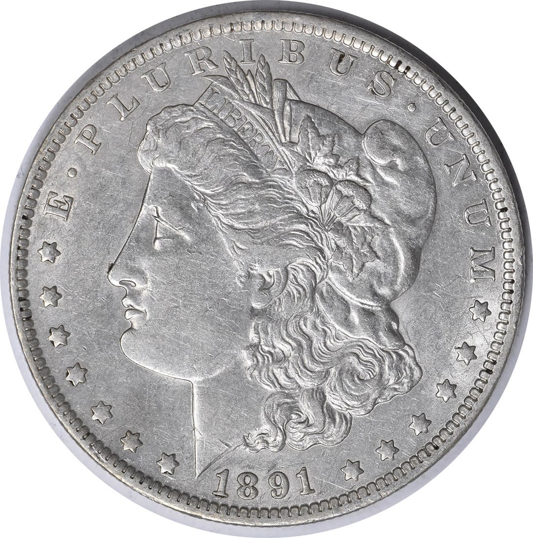 1891-O United States Morgan Dollar 90 Percent Silver XF Uncertified Coin: 1891-O United States Morgan Dollar 90 Percent Silver XF Uncertified Coin This 1891-O Morgan Silver Dollar is a circulated, pre-owned coin minted in New Orleans. Designed by George T. Morgan, it is com