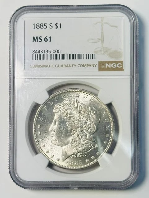 1885-S Morgan Dollar NGC MS61 Silver: 1885-S Morgan Dollar NGC MS61 Silver This 1885 Morgan Silver Dollar was minted in San Francisco and is graded MS-61 by NGC. Composed of silver, this pre-owned coin is a collectible piece from the Unit