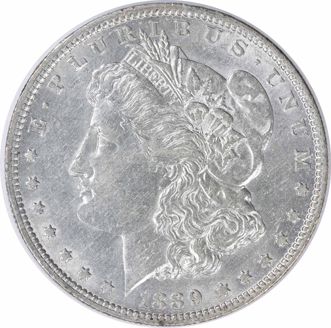 1889-O Morgan Silver Dollar AU Uncertified New Orleans Mint: 1889-O Morgan Silver Dollar AU Uncertified New Orleans Mint This 1889-O Morgan Silver Dollar is a beautiful example of American coinage, featuring a design by George T. Morgan. The coin is circulated 