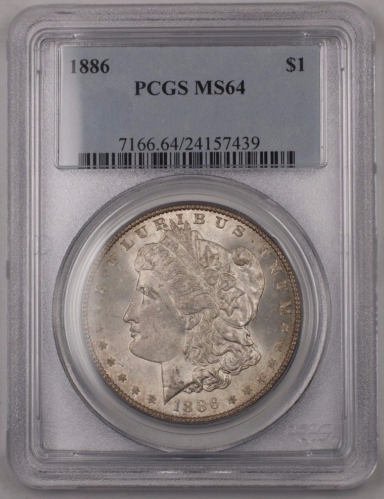 PCGS MS-64 1886 Morgan Dollar Philadelphia Silver $1 Lightly Toned Coin: PCGS MS-64 1886 Morgan Dollar Philadelphia Silver $1 Lightly Toned Coin This 1886 Morgan Silver Dollar was minted in Philadelphia and is certified by PCGS with a grade of MS-64. The coin is composed o