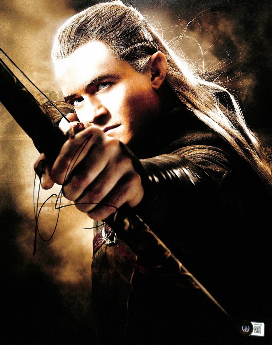 11x14 Photo Signed by Orlando Bloom as Legolas Beckett Authenticated: 11x14 Photo Signed by Orlando Bloom as Legolas Beckett Authenticated This is an autographed 11x14 photograph featuring Orlando Bloom as Legolas from the Lord of the Rings film series. The photograph h
