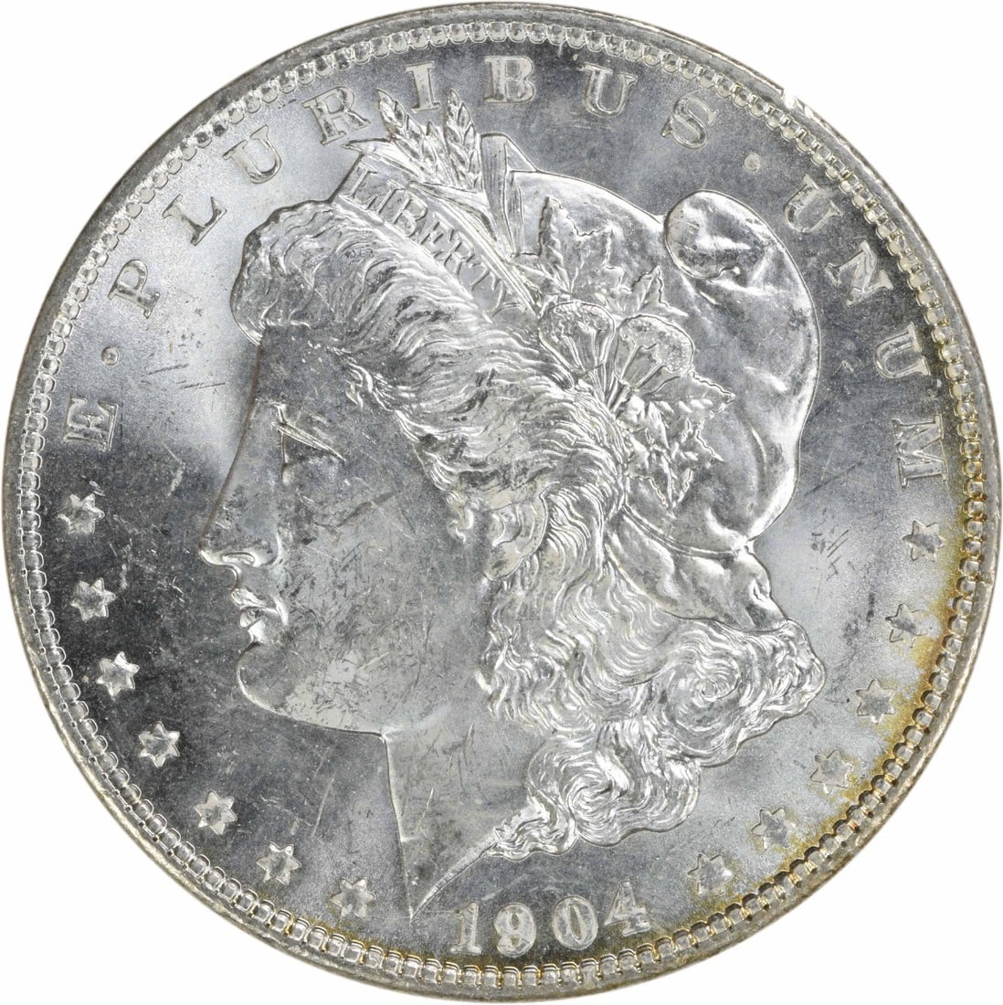 Uncirculated 1904 New Orleans Morgan Silver Dollar Brilliant Uncirculated: Uncirculated 1904 New Orleans Morgan Silver Dollar Brilliant Uncirculated This 1904-O Morgan Silver Dollar is an uncirculated coin from the New Orleans Mint. It is composed of silver and is in Brillia