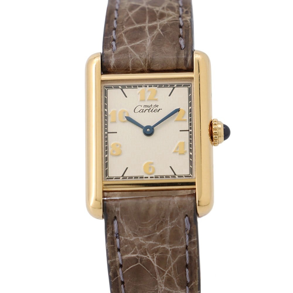 Cartier Must de Tank Vermeil Ladies Quartz White Dial Watch: Cartier Must de Tank Vermeil Ladies Quartz White Dial Watch This Cartier Must Tank SM Vermeille W1008354 is a vintage ladies' wristwatch featuring a classic white dial and quartz movement. Crafted in 
