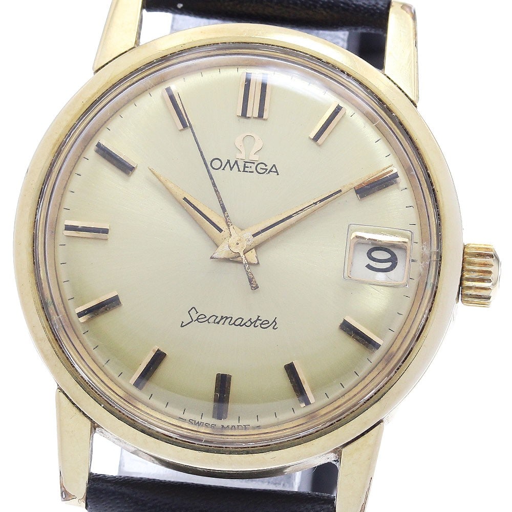 Omega Seamaster Date Men's Manual Wind Watch 14384 61 SC: Omega Seamaster Date Men's Manual Wind Watch 14384 61 SC This OMEGA Seamaster Date wristwatch, reference 14384 61 SC, features a manual winding cal.610 movement and a gold-tone dial. The case is made 