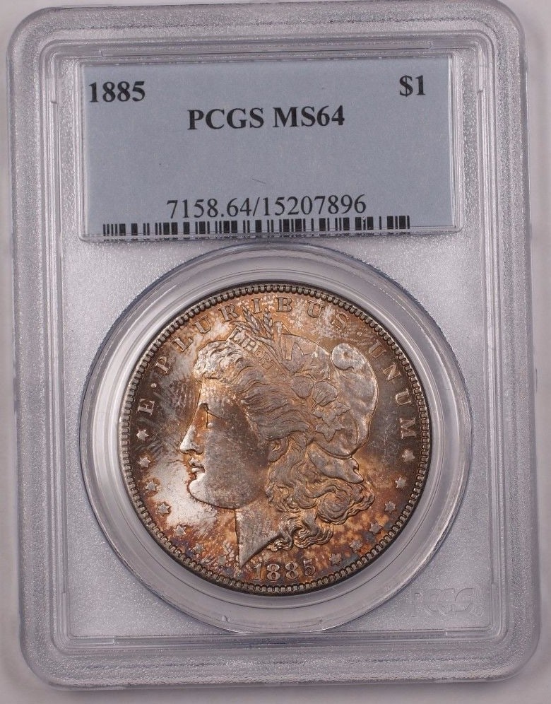 PCGS MS64 1885 Morgan Silver Dollar Philadelphia: PCGS MS64 1885 Morgan Silver Dollar Philadelphia This 1885 US Morgan Silver Dollar features a beautiful natural toning and has been professionally graded MS-64 by PCGS. Minted in Philadelphia, this un