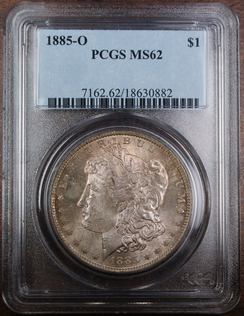PCGS MS62 1885-O Morgan Dollar Silver Coin New Orleans Mint Toned: PCGS MS62 1885-O Morgan Dollar Silver Coin New Orleans Mint Toned This 1885-O Morgan Silver Dollar was minted in New Orleans and has been certified by PCGS with a grade of MS-62. Composed of 90% silve