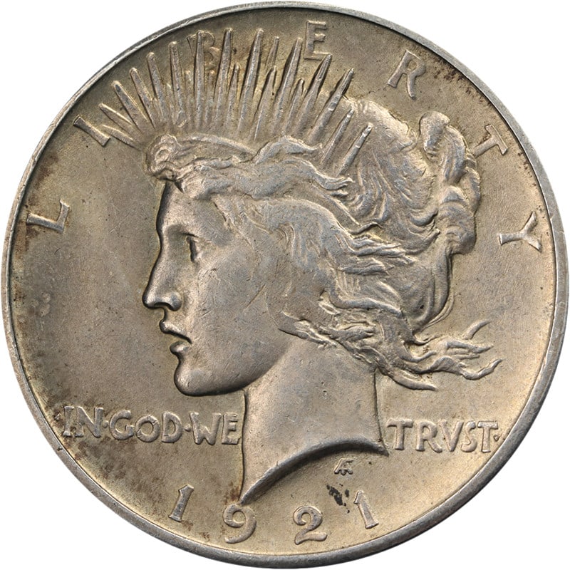 1921 Silver Peace Dollar Uncertified BU+: 1921 Silver Peace Dollar Uncertified BU+ This 1921 Peace Dollar is an uncirculated coin featuring attractive luster, a strong strike, and pleasing surfaces. With a fineness of 0.9 silver, it offers gr