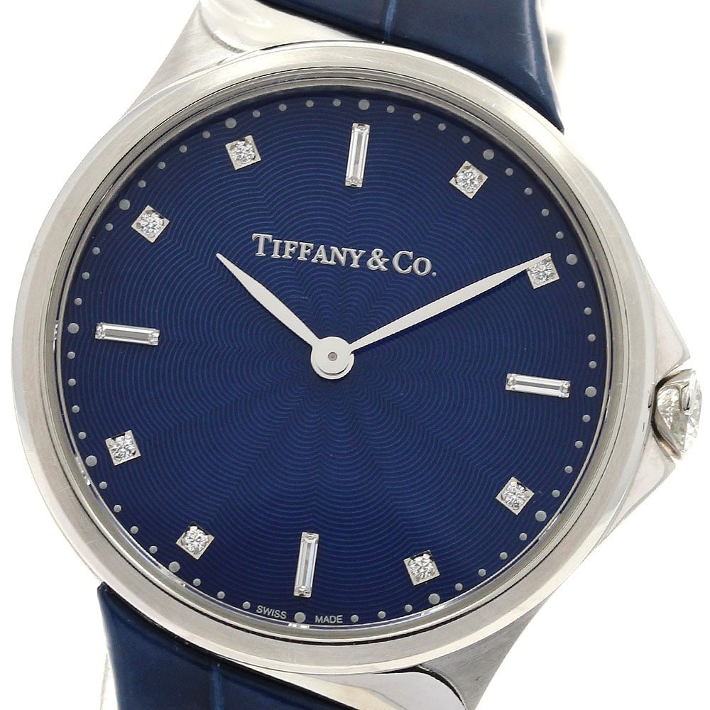Tiffany Metro 2 Hand Quartz Womens Stainless Steel Watch: Tiffany Metro 2 Hand Quartz Womens Stainless Steel Watch This Tiffany & Co. Metro 2 Hand Quartz women's wristwatch features a stainless steel case and a blue dial, complemented by a leather strap. The