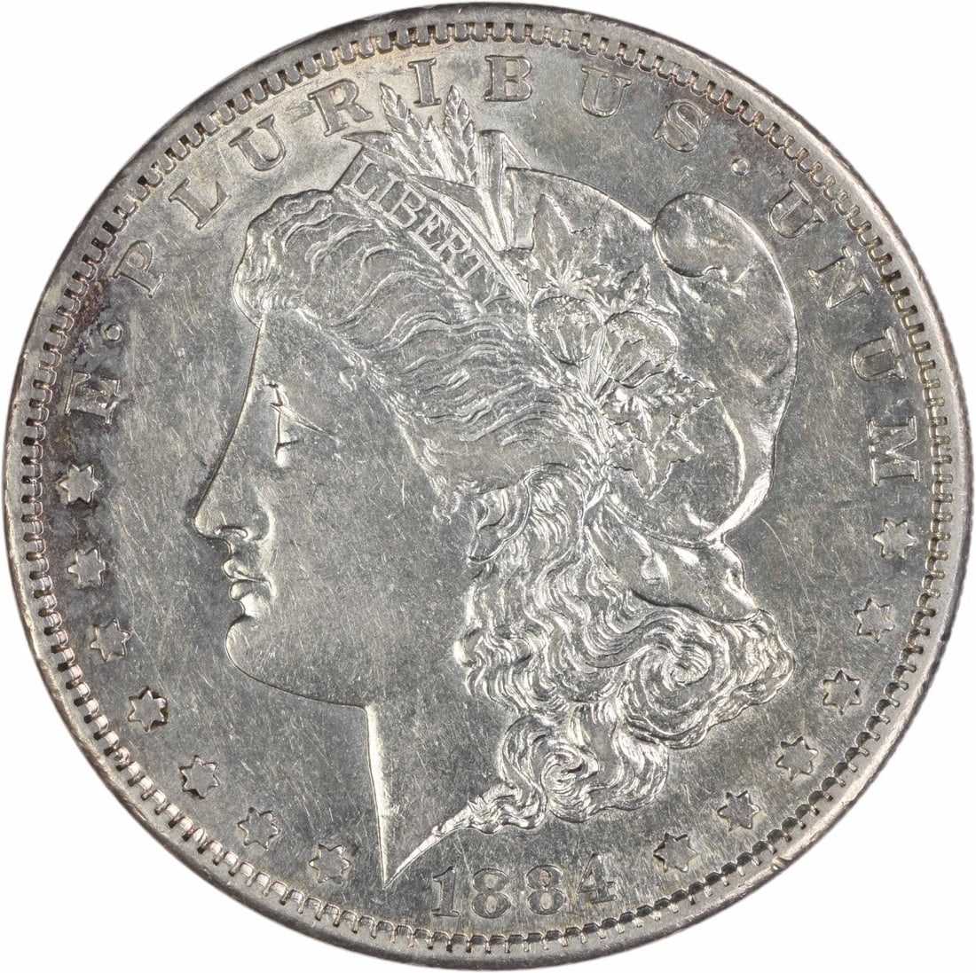 AU Grade 1884 San Francisco Morgan Dollar Uncertified Silver Coin: AU Grade 1884 San Francisco Morgan Dollar Uncertified Silver Coin This 1884-S Morgan Silver Dollar is composed of 90% silver and 10% copper. Minted in San Francisco, it features the design by George T