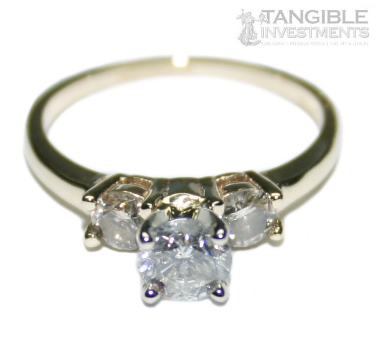 EGL Certified 14K Yellow Gold 3 Diamond Three Stone Ring Size 5: EGL Certified 14K Yellow Gold 3 Diamond Three Stone Ring Size 5 This elegant three-stone ring is crafted from 14-karat yellow gold and features three round brilliant diamonds. The center diamond weigh