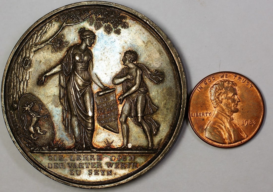 German 1811 Silver Medal Death Head in Clouds Iohann V Oest Design: German 1811 Silver Medal Death Head in Clouds Iohann V Oest Design This 1811 EH Iohann V Oest German Death Head in Clouds medal is composed of silver and features a nicely toned finish. The medal is a