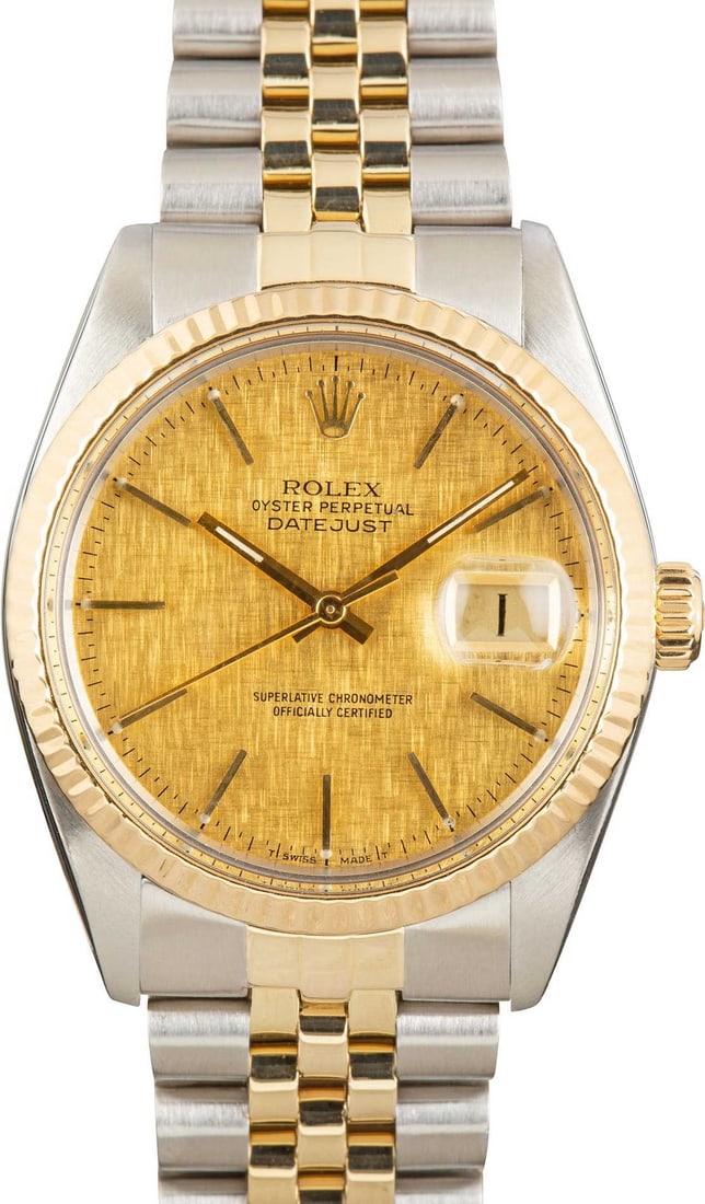 Rolex Datejust 16013 Watch with Champagne Linen Dial and D Link Jubilee Bracelet: Rolex Datejust 16013 Watch with Champagne Linen Dial and D Link Jubilee Bracelet This is a men's Rolex Datejust watch, featuring a champagne linen dial and a fluted bezel. The watch is equipped with a