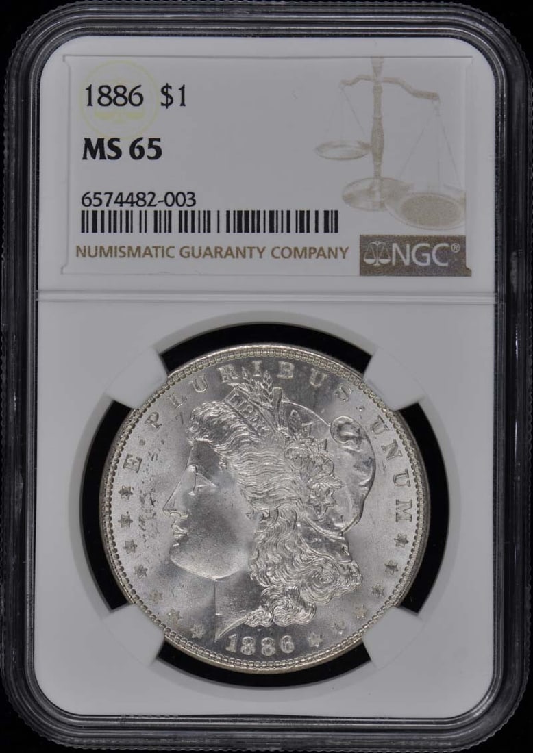 1886 Morgan Dollar NGC MS65 Uncirculated Philadelphia Coin: 1886 Morgan Dollar NGC MS65 Uncirculated Philadelphia Coin This stunning 1886 Morgan Dollar, graded MS65 by NGC, showcases exceptional quality and detail. Certified as uncirculated, this coin originat