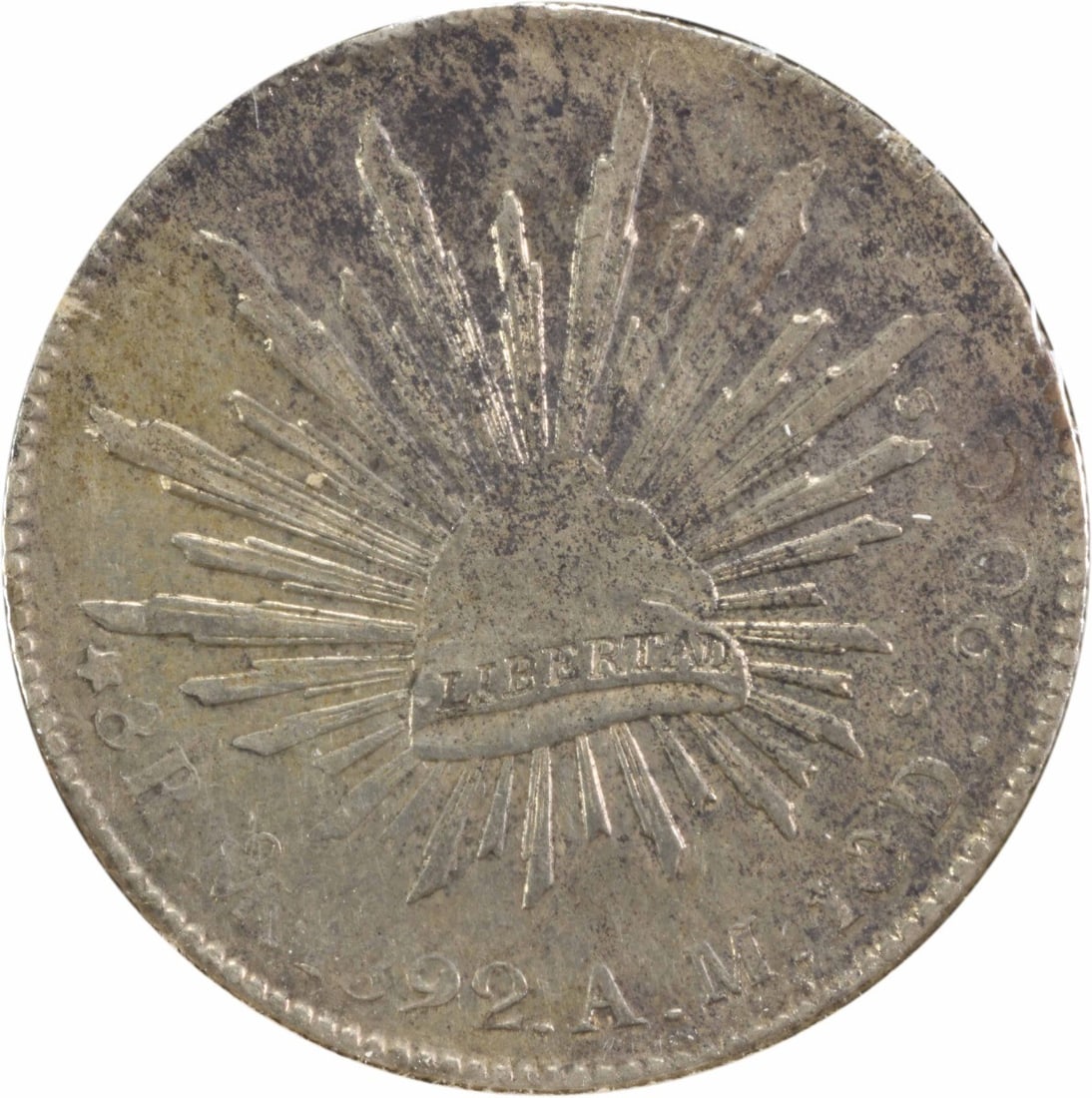 1892 Mo AM Mexico 8 Reales Silver Coin KM377.10 AU Uncertified: 1892 Mo AM Mexico 8 Reales Silver Coin KM377.10 AU Uncertified This 1892 Mo AM Mexico 8 Reales (KM377.10) is a remarkable piece of history. Crafted from silver, this coin is classified as AU (Almost U