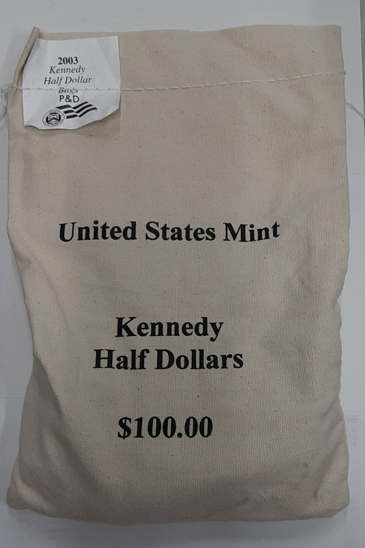 200-coin mint bag 2003-P and D Kennedy half dollars uncirculated: 200-coin mint bag 2003-P and D Kennedy half dollars uncirculated This lot contains a sealed mint bag from 2003, featuring 200 uncirculated Kennedy Half Dollar coins with a total face value of $100. Th