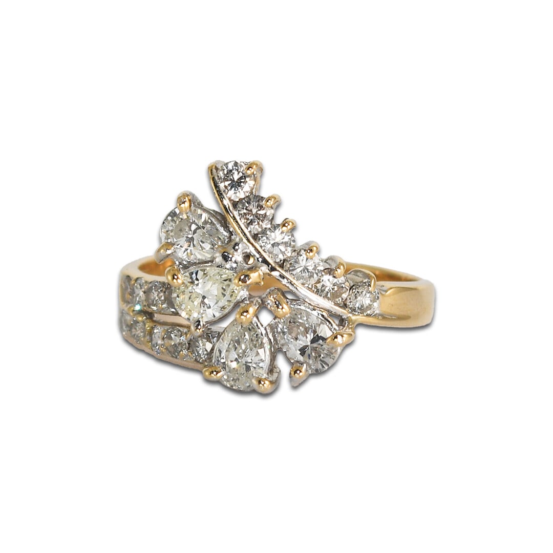14k Yellow Gold Pear Diamond Ring Size 5.5 1.00 ctw: 14k Yellow Gold Pear Diamond Ring Size 5.5 1.00 ctw This elegant ring is crafted from 14k yellow gold and features a total diamond weight of 1.00 to 1.24 carats. The centerpiece includes four pear-sha
