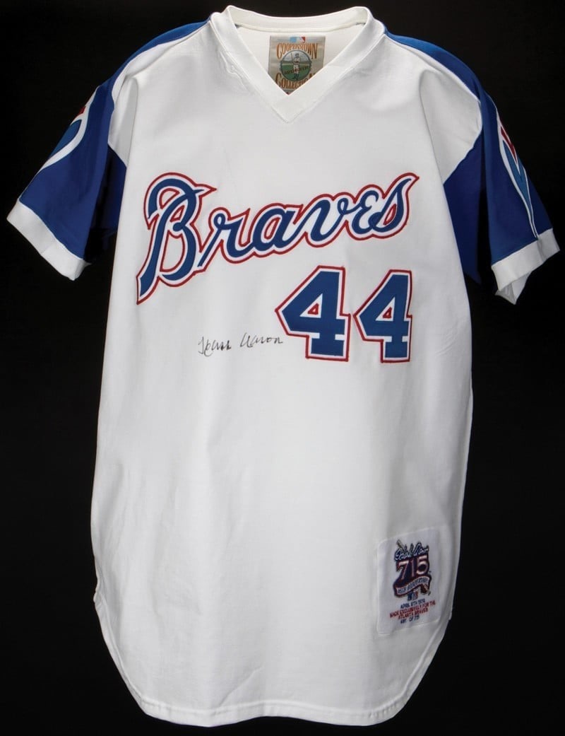 PSA DNA Autographed Hank Aaron Braves Mitchell Ness 715 Home Run Jersey: PSA DNA Autographed Hank Aaron Braves Mitchell Ness 715 Home Run Jersey This Cooperstown Collection Atlanta Braves jersey is signed by Hank Aaron and commemorates his historic 715th home run milestone