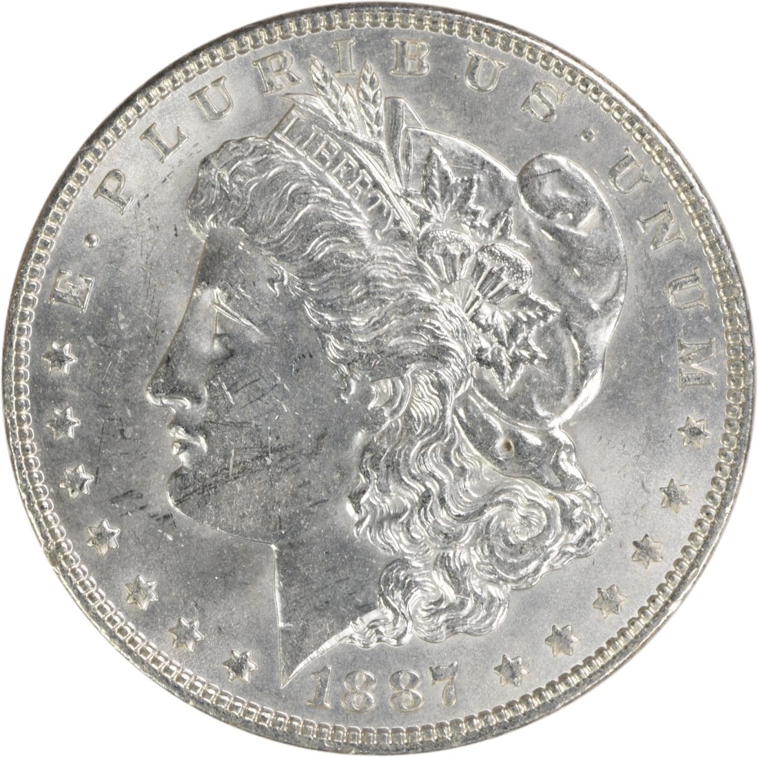 Choice BU 1887 Silver Dollar Morgan Uncirculated Uncertified Coin: Choice BU 1887 Silver Dollar Morgan Uncirculated Uncertified Coin This is an 1887 Morgan Silver Dollar from the United States, featuring a Choice Brilliant Uncirculated (BU) grade. The coin is compose