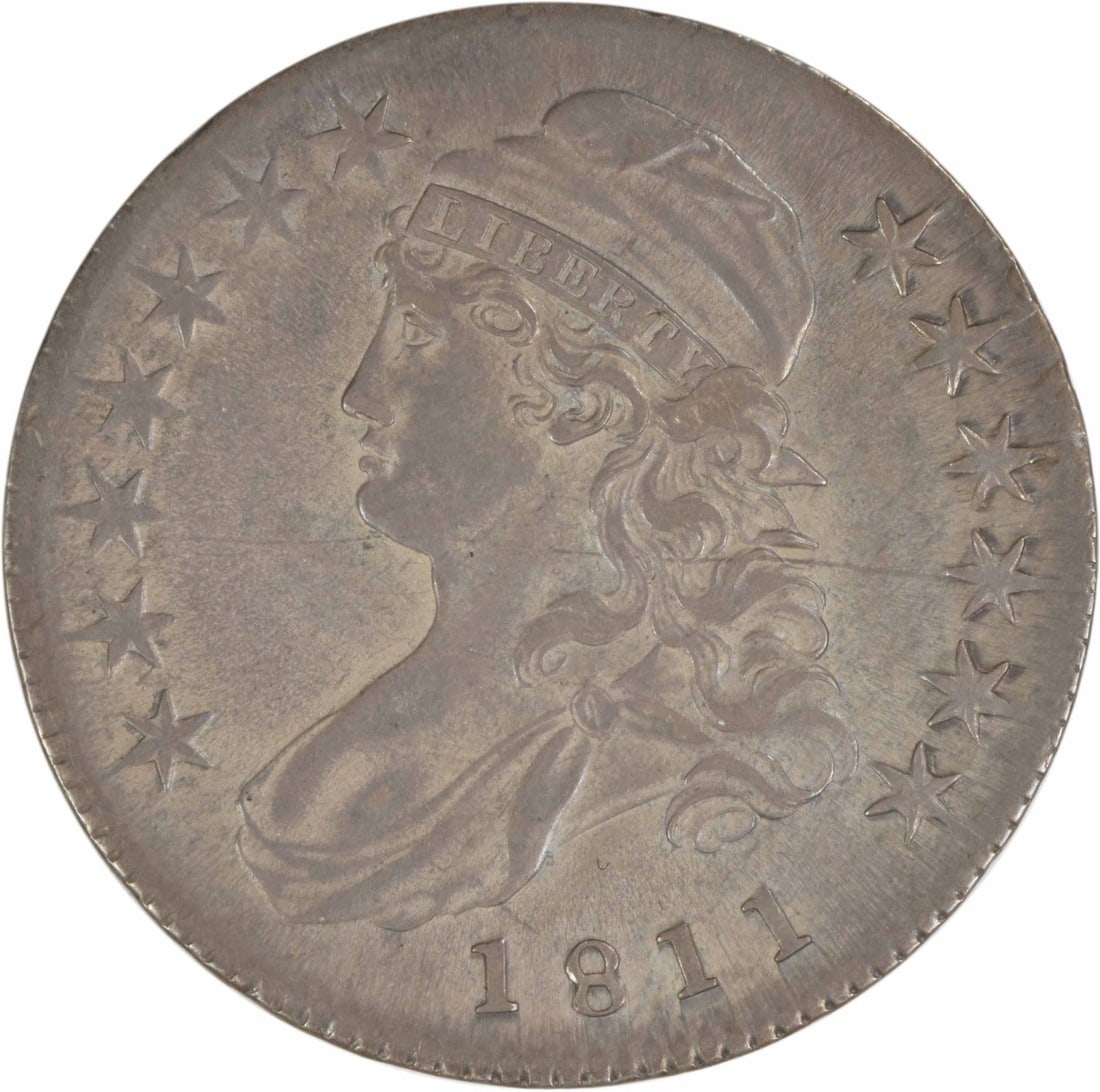 1811 Bust Half Dollar 50C by John Reich Uncertified Silver Coin: 1811 Bust Half Dollar 50C by John Reich Uncertified Silver Coin This 1811 Bust Half Dollar is a remarkable piece of American numismatic history, showcasing the artistry of designer John Reich. The coi