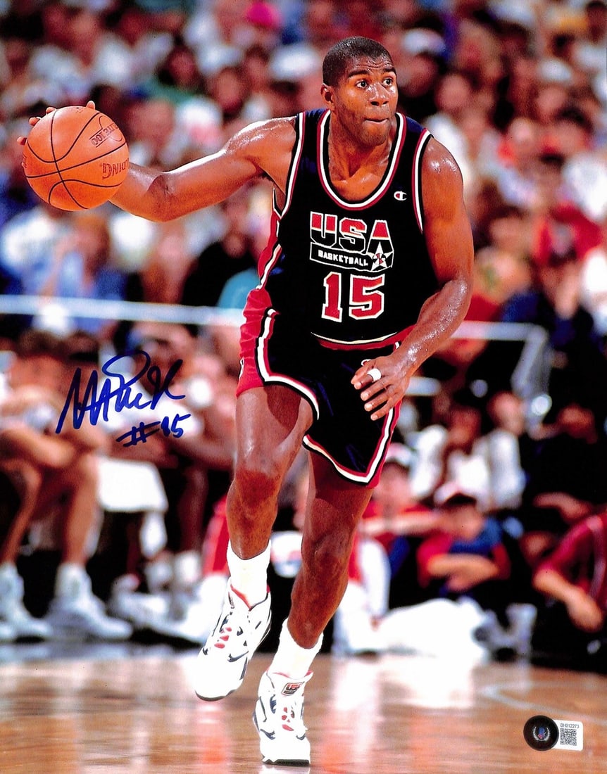 Magic Johnson Autographed 11x14 Photo Beckett Certified #15: Magic Johnson Autographed 11x14 Photo Beckett Certified #15 This striking 11x14 photograph captures the legendary Magic Johnson in action, featuring his signature in bold blue permanent marker along w