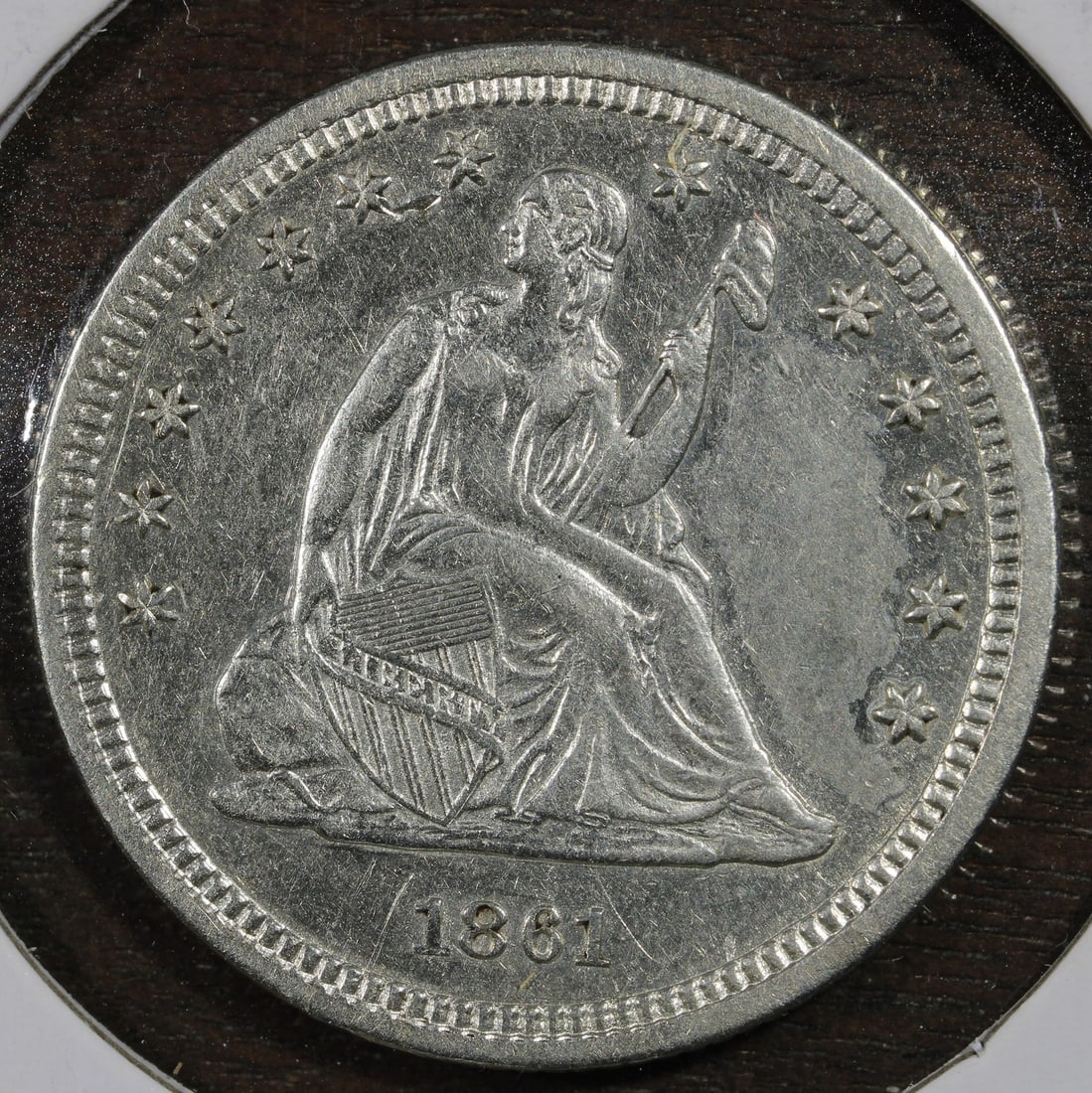 1861 Silver Seated Liberty Quarter 25C Philadelphia Coin: 1861 Silver Seated Liberty Quarter 25C Philadelphia Coin 1861 Seated Liberty Quarter 25C in AU condition, composed of silver with 0.9 fineness. The coin is from Philadelphia and was circulated, with a