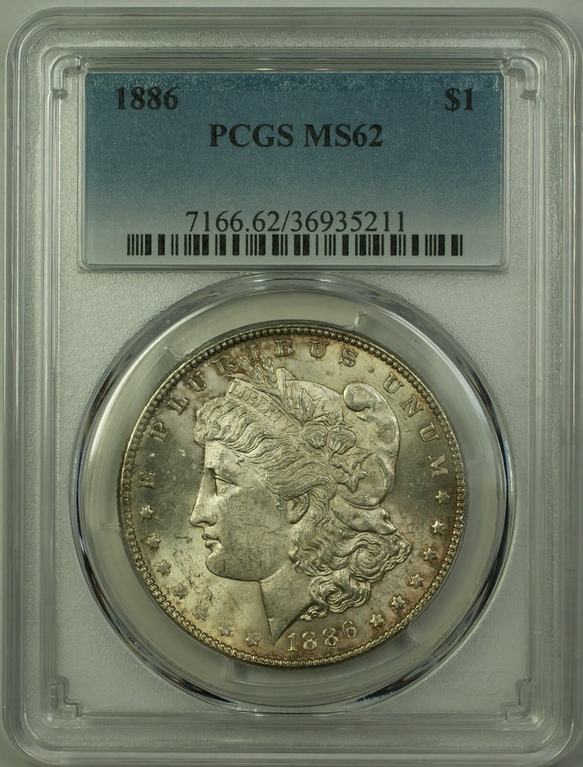 PCGS MS62 1886 Morgan Silver Dollar Philadelphia: PCGS MS62 1886 Morgan Silver Dollar Philadelphia This 1886 Morgan Silver Dollar is graded MS-62 by PCGS and features a lightly toned finish. Minted in Philadelphia, it is composed of silver and remain