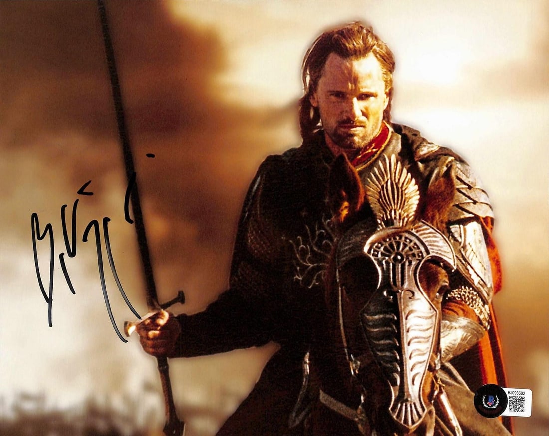 Beckett Authenticated Viggo Mortensen 8x10 Lord of the Rings Autograph: Beckett Authenticated Viggo Mortensen 8x10 Lord of the Rings Autograph This is a signed 8x10 photograph featuring Viggo Mortensen in his role from The Lord of the Rings. The autograph is authenticated