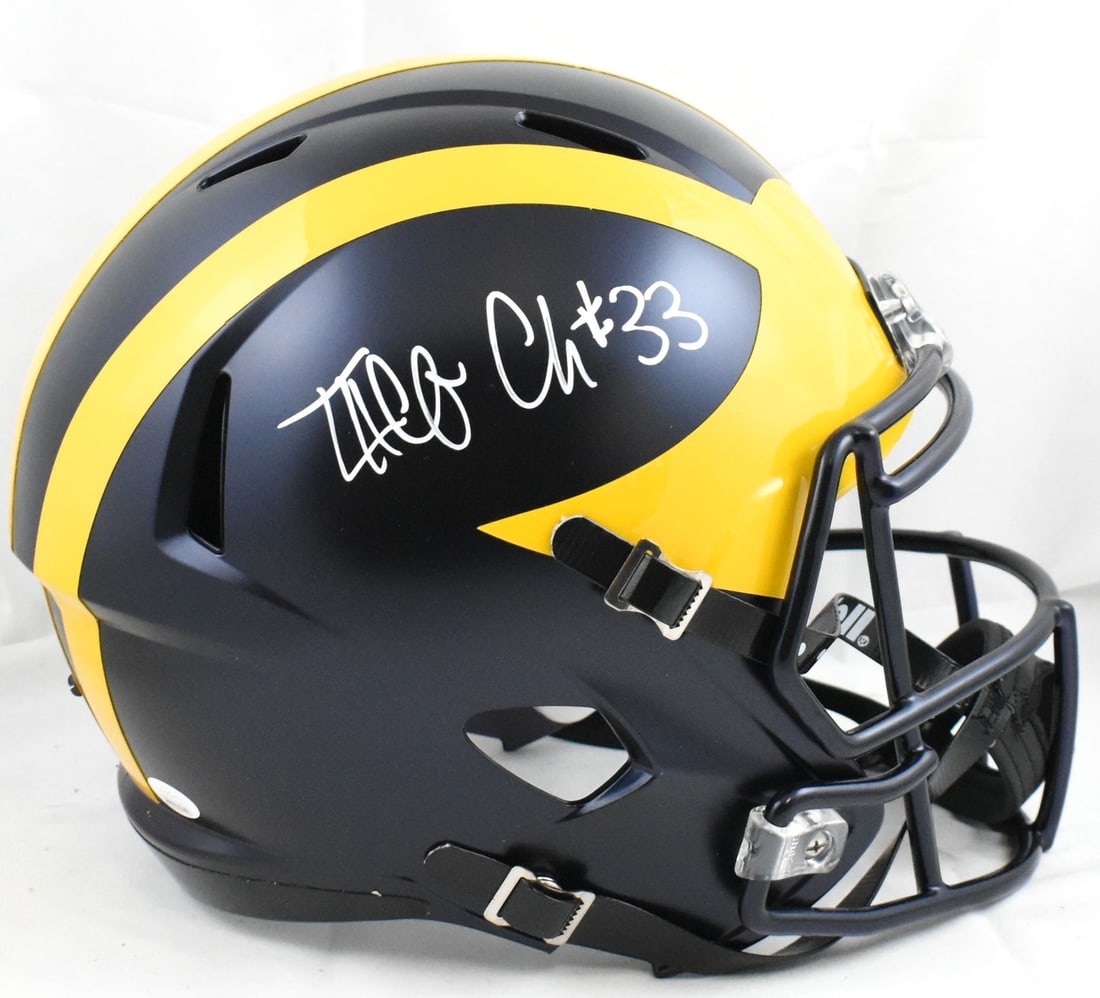 Signed Michigan Wolverines Full Size Speed Football Helmet by Taco Charlton with JSA: Signed Michigan Wolverines Full Size Speed Football Helmet by Taco Charlton with JSA This full-size Michigan Wolverines Speed helmet features an authentic autograph from Taco Charlton. The helmet is a