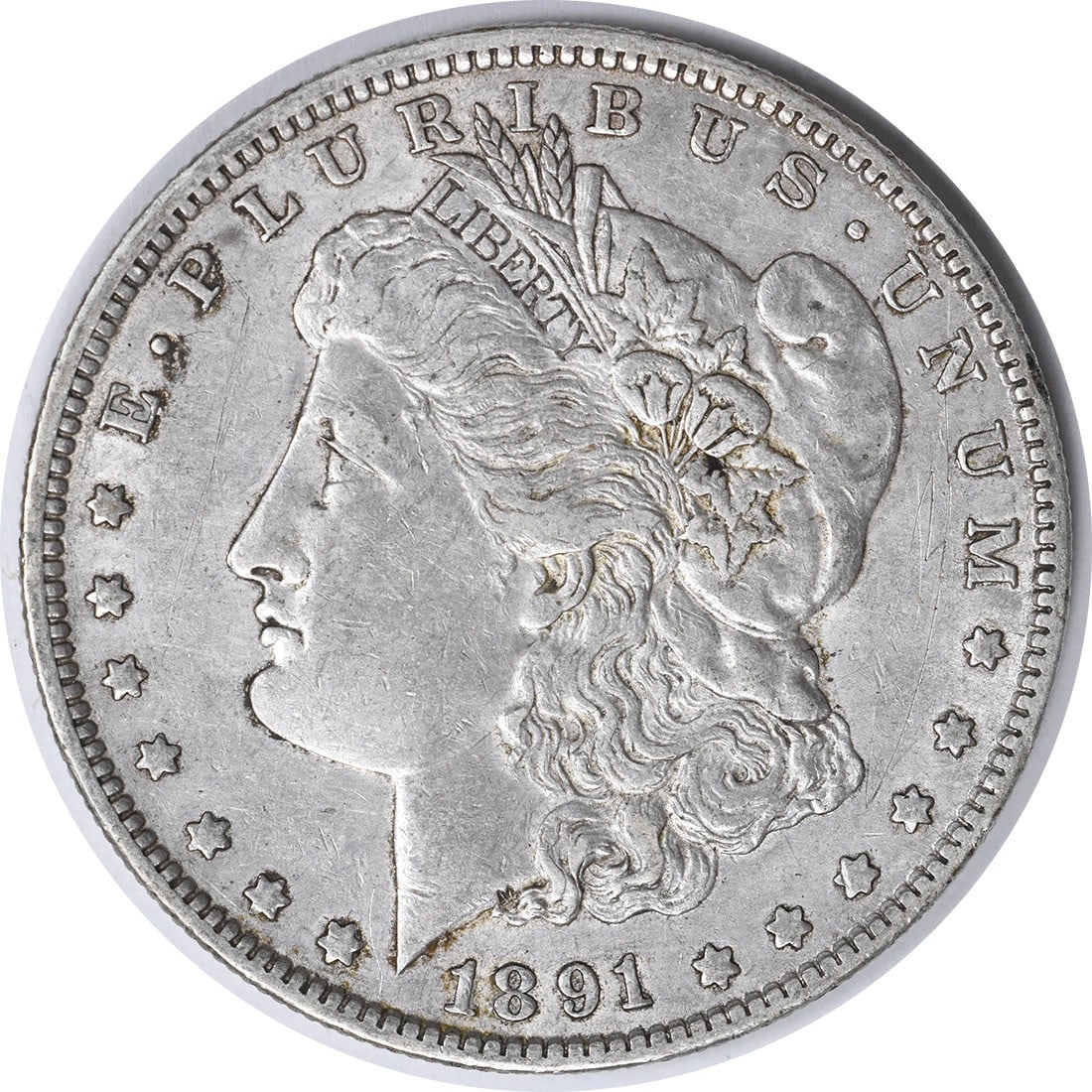 1891-O Morgan Silver Dollar Uncertified 90% Silver Coin: 1891-O Morgan Silver Dollar Uncertified 90% Silver Coin This 1891-O Morgan Silver Dollar is a classic piece of American numismatics, featuring a stunning design by George T. Morgan. This coin, minted 