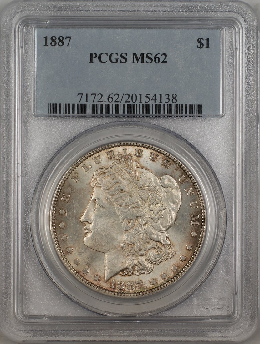 PCGS MS62 1887 Morgan silver dollar toned: PCGS MS62 1887 Morgan silver dollar toned This 1887 Morgan Silver Dollar is graded MS-62 by PCGS and features attractive toning. Struck in Philadelphia, this uncirculated coin is composed of silver an