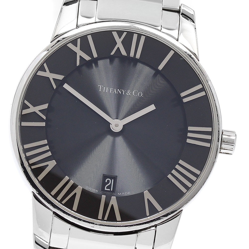 Tiffany Atlas Dome quartz stainless steel men's wristwatch: Tiffany Atlas Dome quartz stainless steel men's wristwatch This is a pre-owned Tiffany & Co. Atlas Dome men's wristwatch featuring a stainless steel case and band. The watch is equipped with a black d