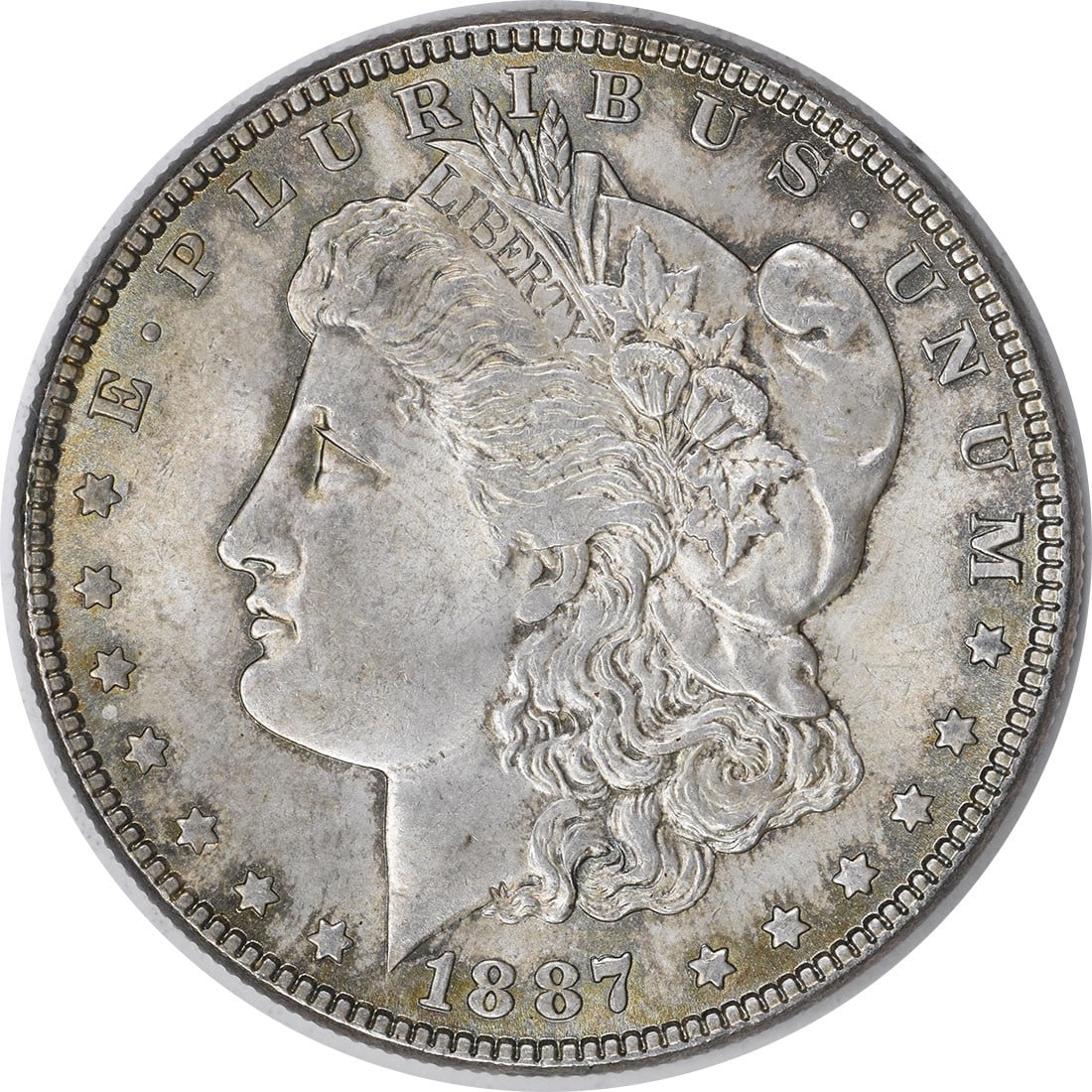 Choice BU 1887 Silver Morgan Dollar with Attractive Toning Uncertified: Choice BU 1887 Silver Morgan Dollar with Attractive Toning Uncertified This 1887 Morgan Silver Dollar features a beautiful toned finish and is in Choice Brilliant Uncirculated condition. The coin is u