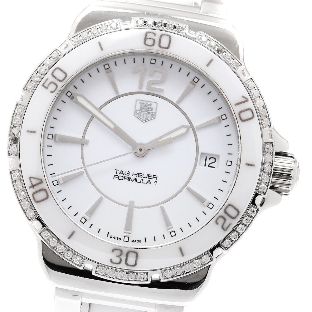TAG Heuer Formula 1 Women's Quartz Date Watch WAH1213: TAG Heuer Formula 1 Women's Quartz Date Watch WAH1213 This TAG Heuer Formula 1 WAH1213 women's wristwatch features a stainless steel and ceramic case and bracelet, paired with a white dial. The watch 