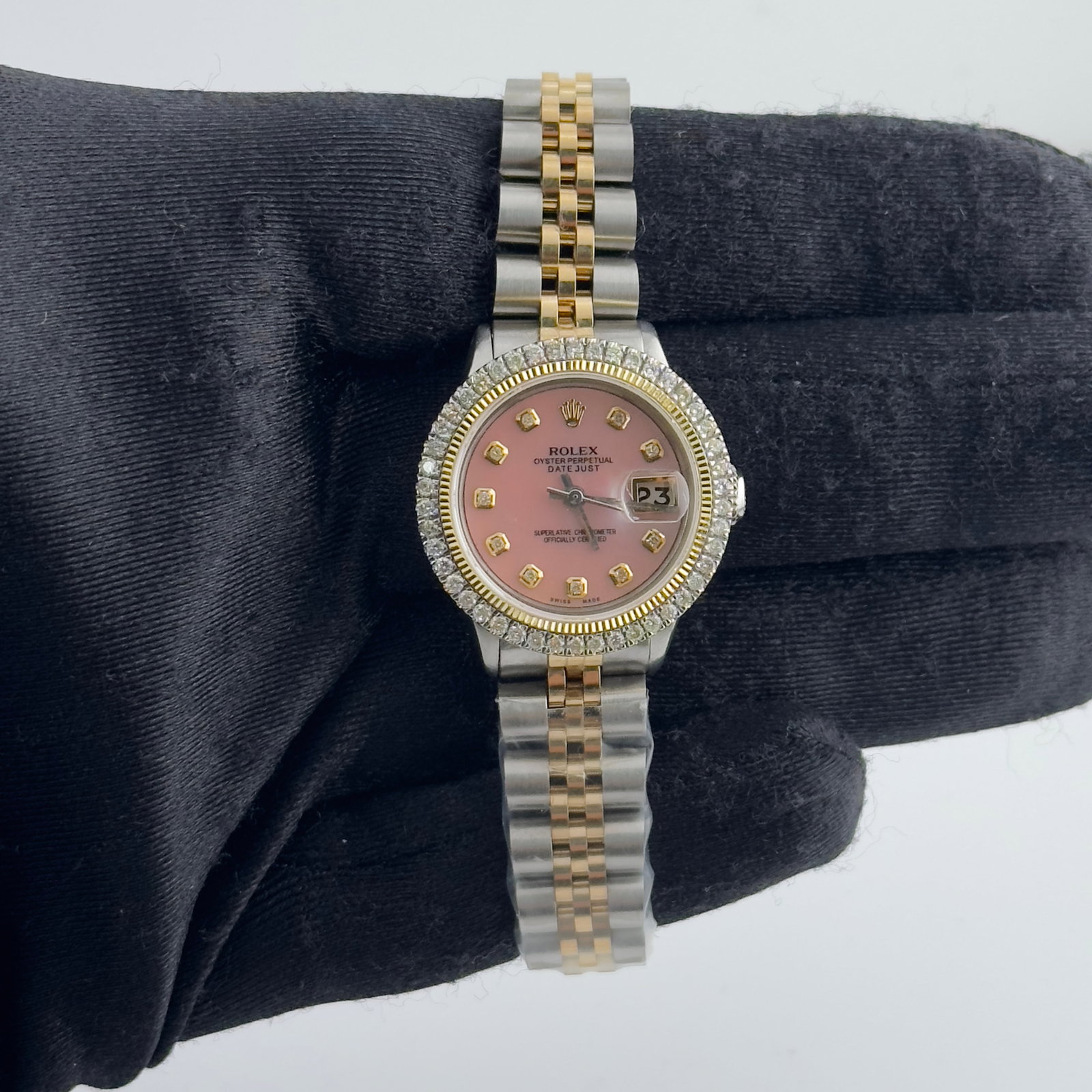 Rolex Datejust Ladies 6517 Aftermarket Pink Yellow Diamond Dial Jubilee Bracelet: Rolex Datejust Ladies 6517 Aftermarket Pink Yellow Diamond Dial Jubilee Bracelet This ladies' Rolex Datejust features an aftermarket pink dial with yellow diamond markers, complemented by an aftermark