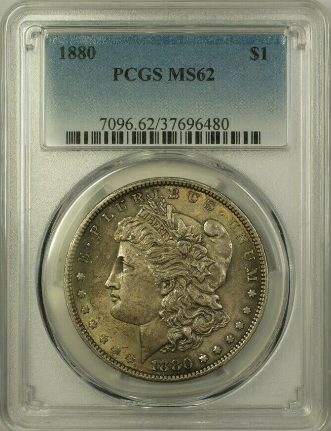 PCGS MS-62 1880 Morgan Dollar Silver Coin With Toning: PCGS MS-62 1880 Morgan Dollar Silver Coin With Toning This 1880 Morgan Silver Dollar coin was minted in Philadelphia and is certified by PCGS with a grade of MS-62. The coin features attractive toning
