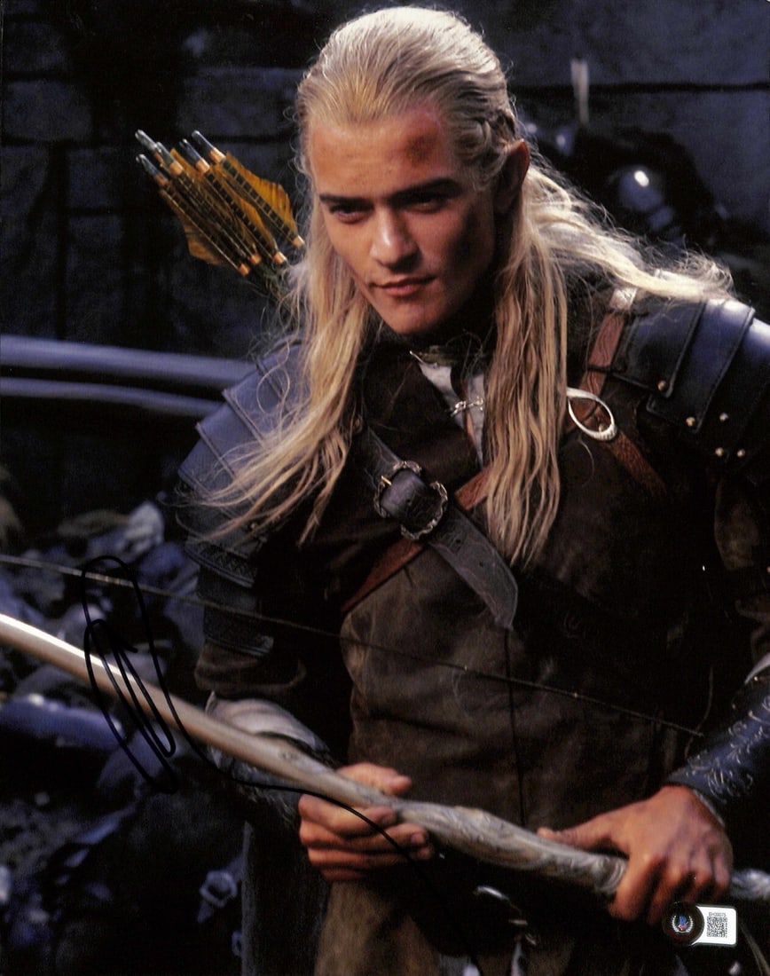11x14 Signed Photo of Orlando Bloom as Legolas with Beckett Authentication: 11x14 Signed Photo of Orlando Bloom as Legolas with Beckett Authentication This is an autographed 11x14 photograph signed in black permanent marker by Orlando Bloom, who portrayed Legolas in The Lord 