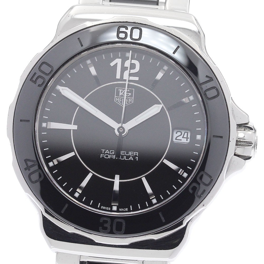 TAG Heuer Formula 1 WAH1210 Black Dial Quartz Date Watch: TAG Heuer Formula 1 WAH1210 Black Dial Quartz Date Watch This TAG Heuer Formula 1 WAH1210 women's wristwatch features a stainless steel and ceramic case and bracelet, paired with a black dial. Powered