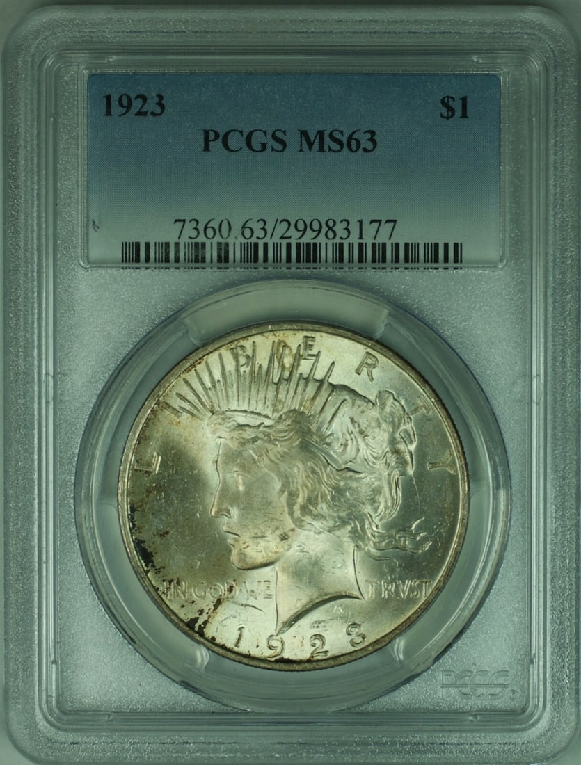 PCGS MS63 1923 Peace Dollar Silver Coin with Light Toning: PCGS MS63 1923 Peace Dollar Silver Coin with Light Toning This is a 1923 Peace Silver Dollar graded MS63 by PCGS. The coin is lightly toned, uncirculated, and was minted in Philadelphia. It is compose
