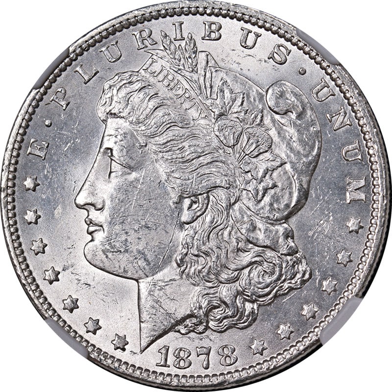 1878-P Morgan Silver Dollar NGC MS61 Blast White Eye Appeal: 1878-P Morgan Silver Dollar NGC MS61 Blast White Eye Appeal This stunning 1878-P 7TF Rev 79 Morgan Silver Dollar is certified by NGC with a grade of MS61, showcasing its uncirculated condition. The co