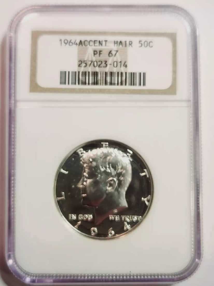 1964 Kennedy Half Dollar NGC PF 67 Accent Hair: 1964 Kennedy Half Dollar NGC PF 67 Accent Hair This 1964 Kennedy Half Dollar features the sought-after Accent Hair variety and has been certified by NGC with a grade of PF 67. Struck in silver at the 