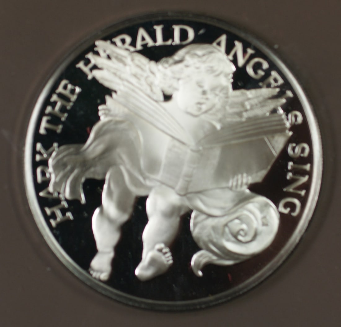 Sterling Silver 1983 Hark Herald Angels Sing Proof Holiday Medal: Sterling Silver 1983 Hark Herald Angels Sing Proof Holiday Medal This is a 1983 Franklin Mint holiday medal titled 'Hark Herald Angels Sing', crafted in sterling silver with a proof finish. It was pro