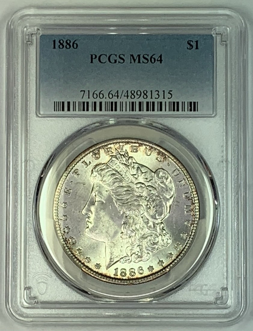 PCGS MS 64 1886 Morgan Silver Dollar Coin United States $1: PCGS MS 64 1886 Morgan Silver Dollar Coin United States $1 This is an 1886 Morgan Silver Dollar coin from the United States, graded MS 64 by PCGS. The coin is uncirculated and composed of silver, maki