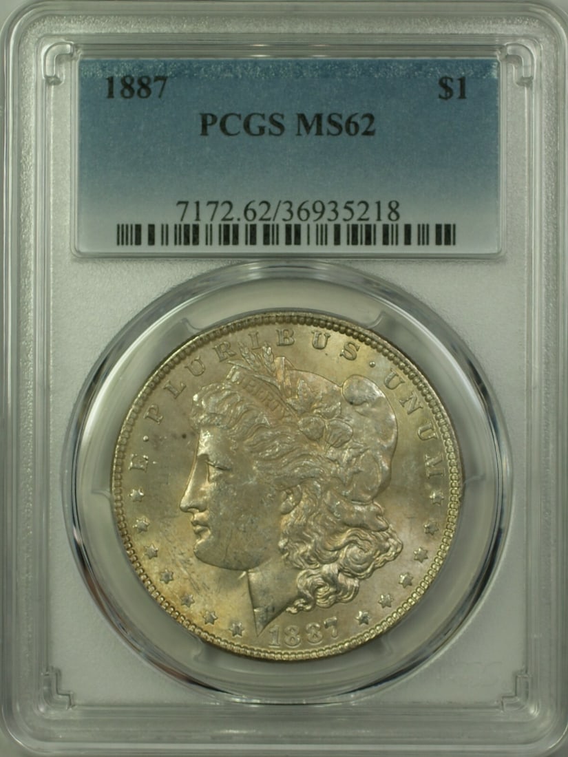 PCGS MS62 1887 Morgan Dollar Silver Coin Lightly Toned Obverse: PCGS MS62 1887 Morgan Dollar Silver Coin Lightly Toned Obverse This 1887 Morgan Silver Dollar is an uncirculated $1 coin from the United States, featuring a lightly toned obverse. Certified and graded