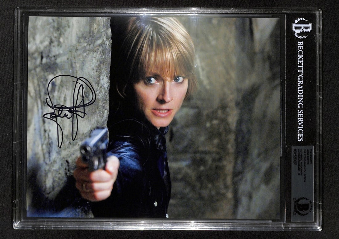 Jodie Foster Signed Silence of the Lambs 8x10 Photo Beckett 10: Jodie Foster Signed Silence of the Lambs 8x10 Photo Beckett 10 This stunning 8x10 color photograph features Jodie Foster in her iconic role from "The Silence of the Lambs," beautifully signed in black