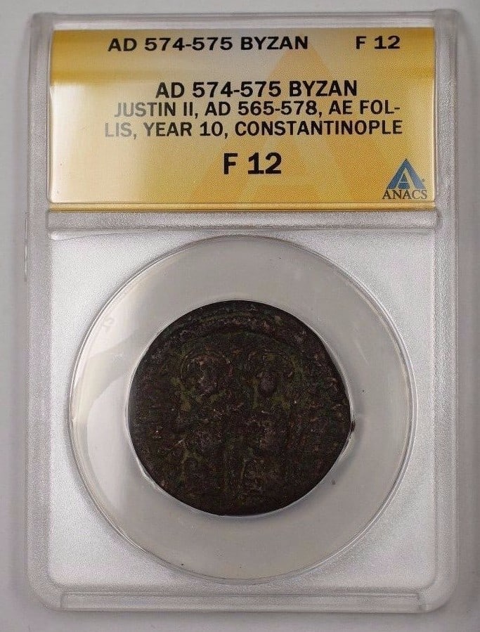 Justin II AE Follis Silver Coin ANACS F-12 Constantinople 574-575: Justin II AE Follis Silver Coin ANACS F-12 Constantinople 574-575 This is an ancient Byzantine coin from the reign of Justin II, dated 574-575. The coin is an AE Follis from Constantinople and has bee