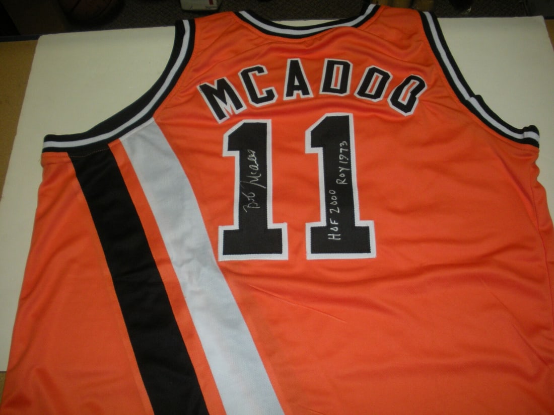 Signed Orange Jersey Bob McAdoo Buffalo Braves COA Hall of Fame MVP 1975: Signed Orange Jersey Bob McAdoo Buffalo Braves COA Hall of Fame MVP 1975 This is a pre-owned Buffalo Braves jersey signed by Bob McAdoo, Hall of Fame inductee in 2000 and 1975 NBA MVP. The jersey is o