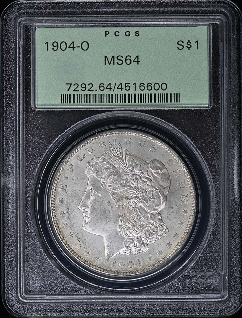 1904-O Morgan Dollar PCGS MS64 New Orleans Mint: 1904-O Morgan Dollar PCGS MS64 New Orleans Mint This 1904-O Morgan Dollar is graded MS64 by PCGS and comes in an Old Green Holder (OGH). Struck at the New Orleans Mint, this uncirculated coin is a cla