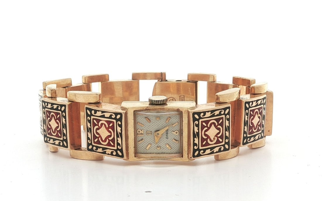 Omega 14k Yellow Gold Square Wristwatch With Black and Red Enamel Bracelet: Omega 14k Yellow Gold Square Wristwatch With Black and Red Enamel Bracelet This vintage Omega wristwatch features a solid 14k yellow gold case and bracelet with a distinctive black and red enamel text