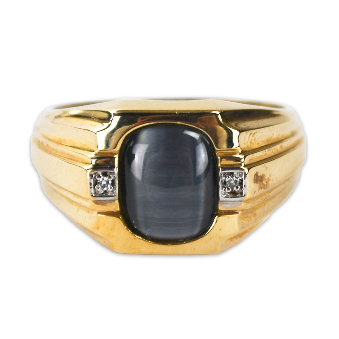 Cat's Eye 10K Yellow Gold Cocktail Ring Size 10.75: Cat's Eye 10K Yellow Gold Cocktail Ring Size 10.75 This pre-owned cocktail ring features a striking dark grey cat's eye gemstone set in 10k yellow gold. The ring is stamped 10k, has a gross weight of 
